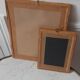 Paire de miroirs anciens en bois et en plâtre doré