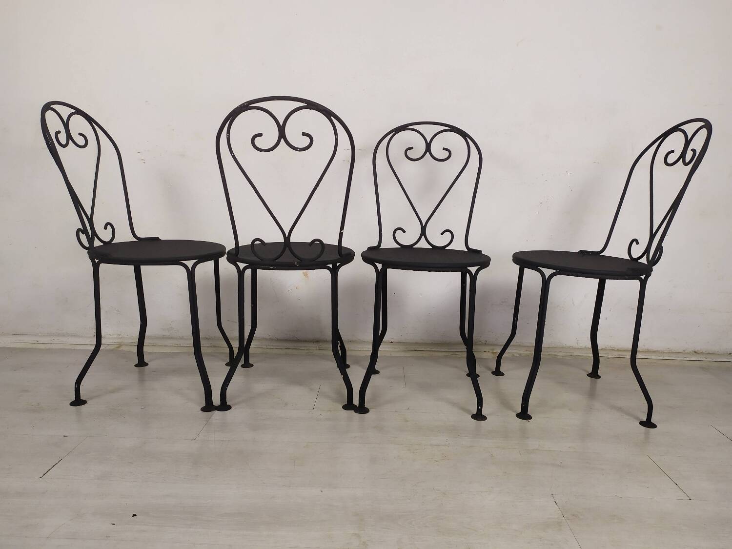 4 black garden chairs