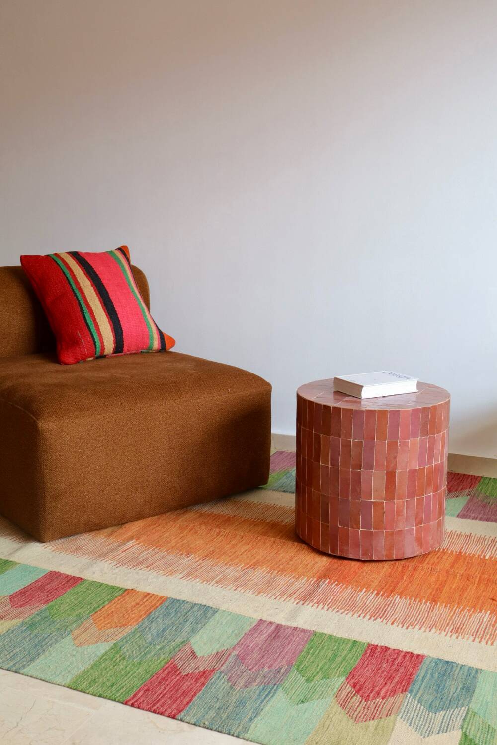 White suzani kilim rug with embroidered multi-colored patterns