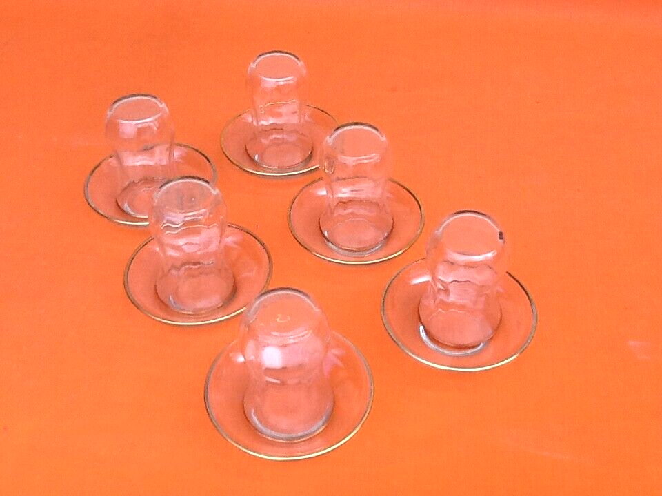 Transparent glass tea service with gilding.
