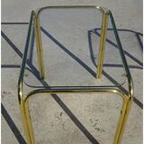 Nesting tables in gold-tone metal and glass