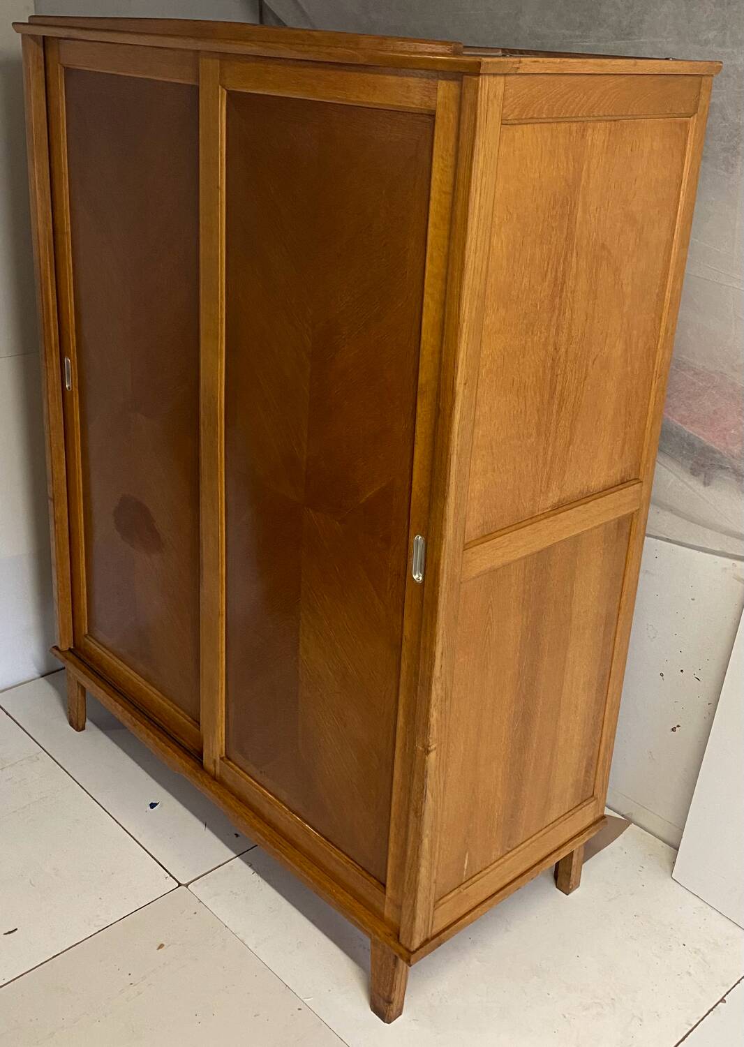 Vintage wardrobe with compass feet, sliding doors