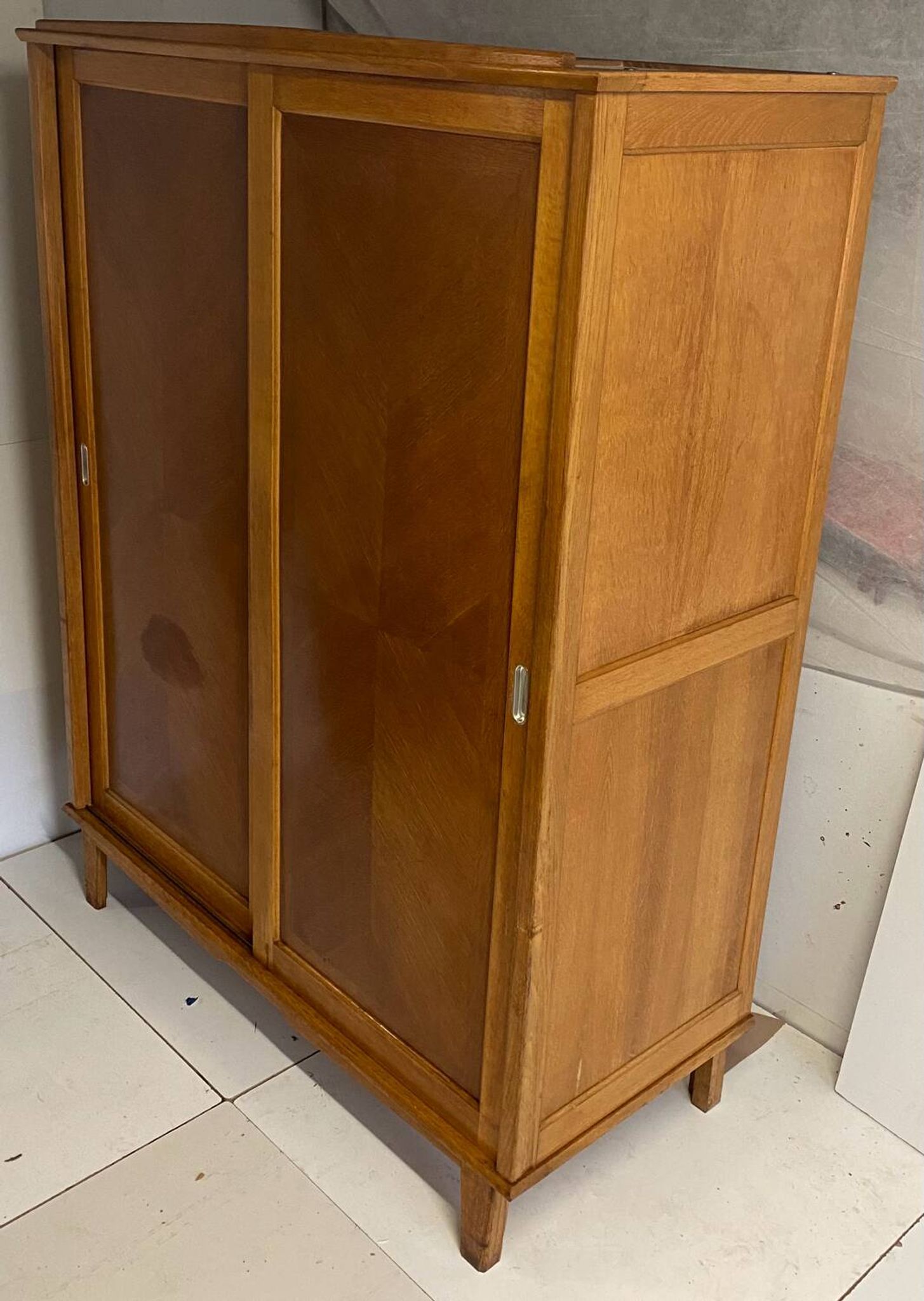 Vintage wardrobe with compass feet, sliding doors