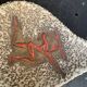 Glassed ceramic cut enamelled prehistoric warrior motif vintage red 1950