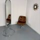 Large freestanding chrome metal full-length mirror in 1970s design.