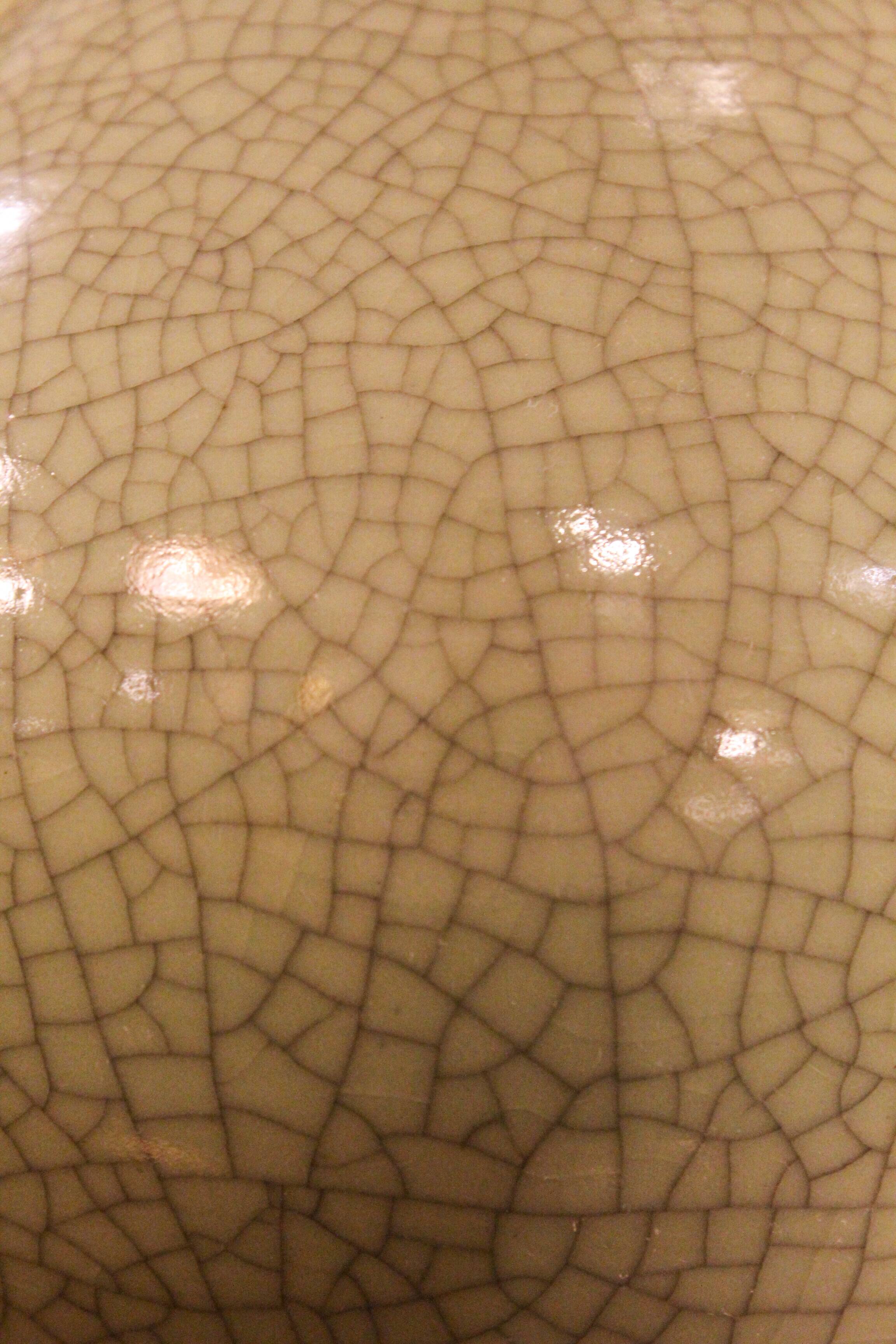 Ceramic lamp with a crackled celadon green finish.