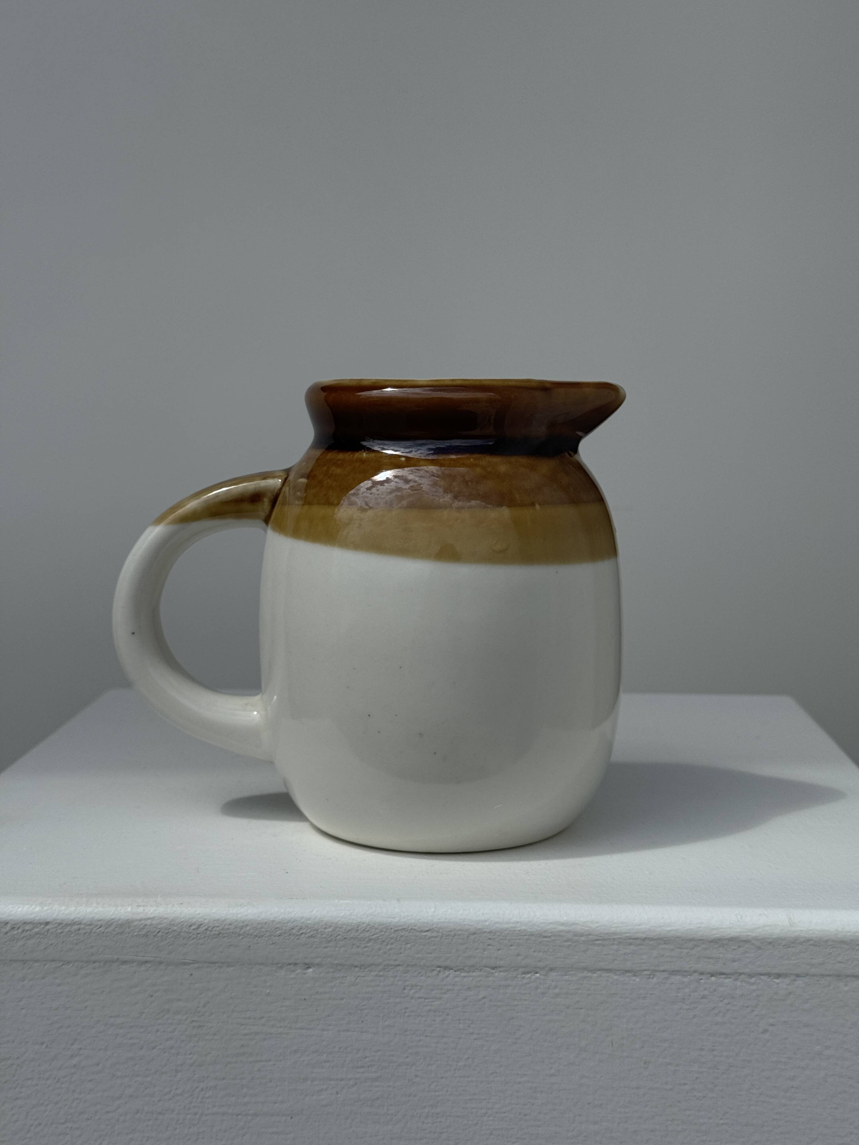 Small two-tone white and brown pitcher Made in China