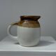 Small two-tone white and brown pitcher Made in China