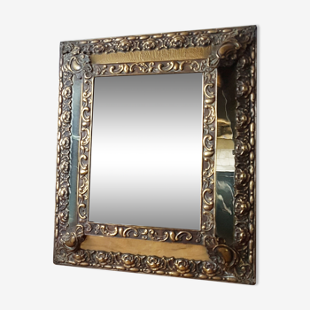 Old mirror made of wood and brass at the beginning of the 20th century