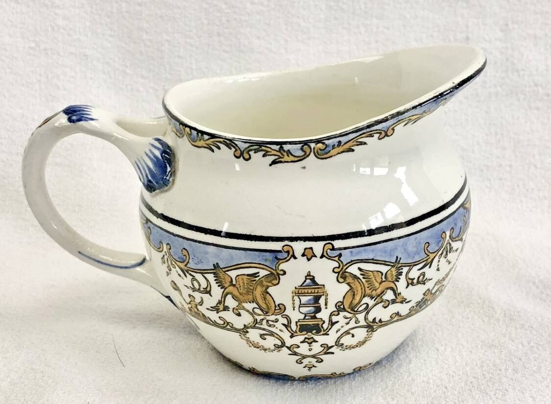 Old cream jug for children at the Dionysos press Gien