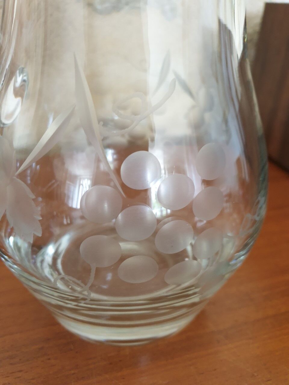 Pitcher decorating grape bunch