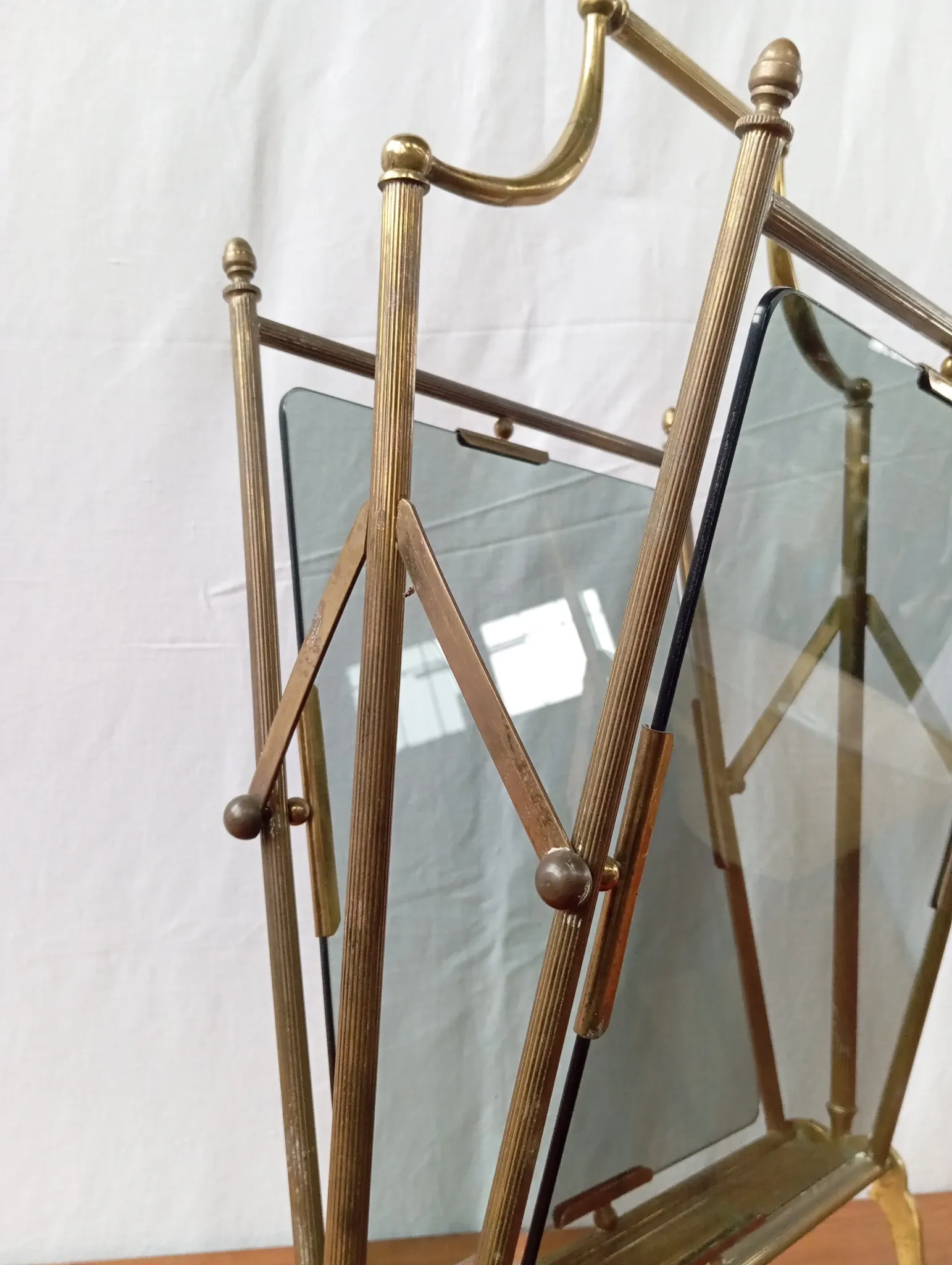 Neo-classical brass magazine rack in the spirit of Maison Jansen.