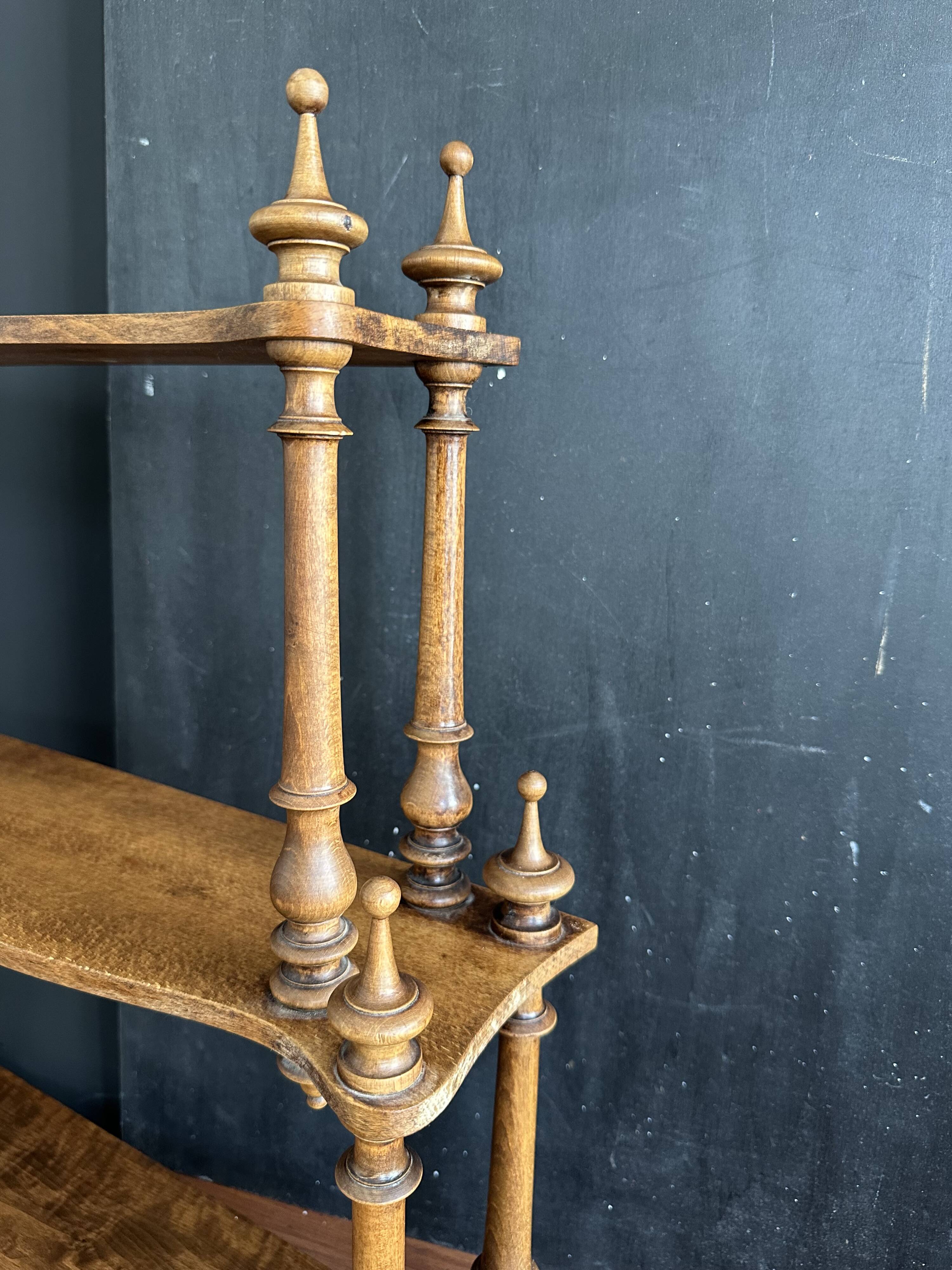 Antique turned wooden shelf with three levels, around 1900.