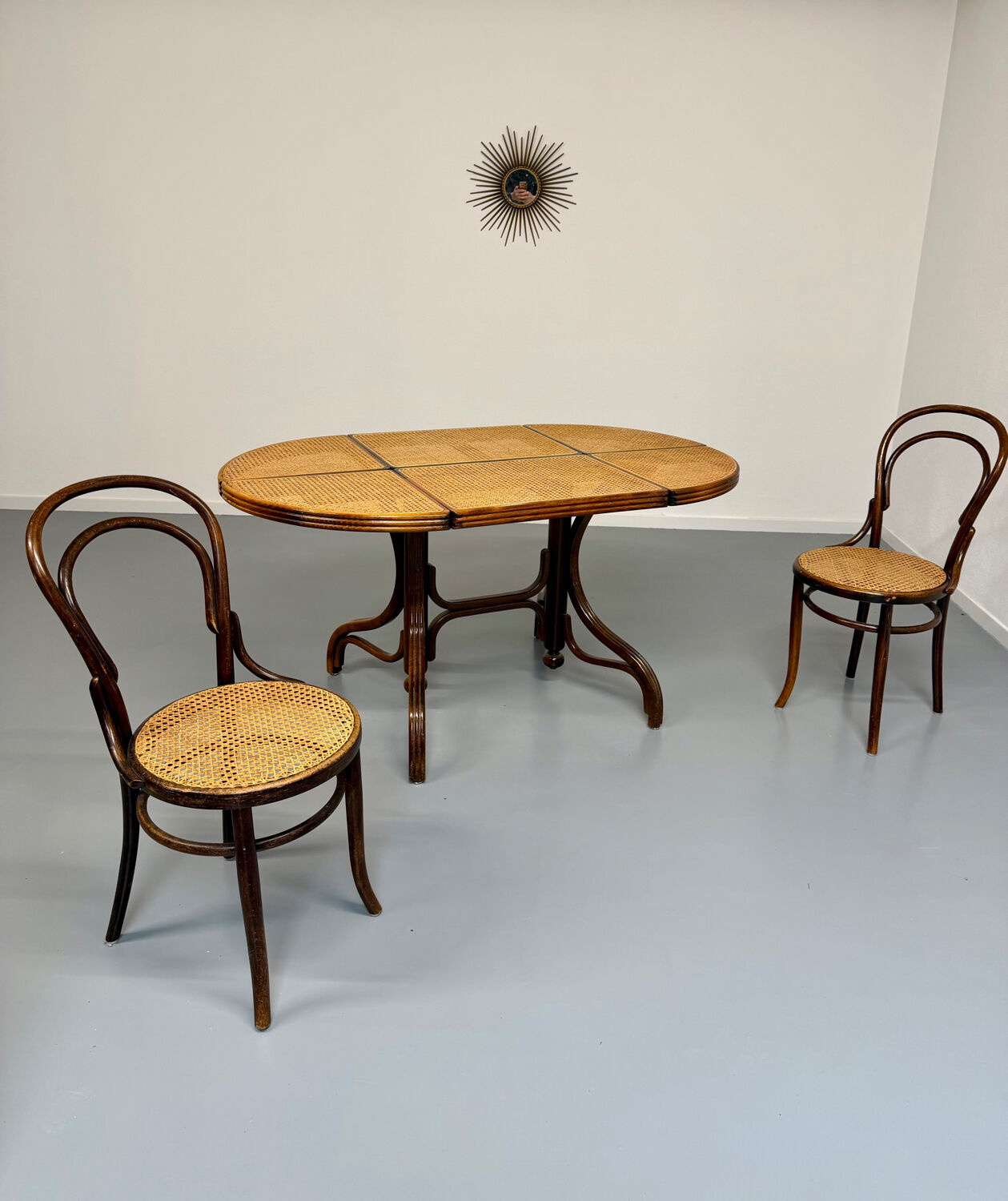 Vintage dining table with a cane top by Mundus from the 1970s.