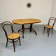 Vintage dining table with a cane top by Mundus from the 1970s.