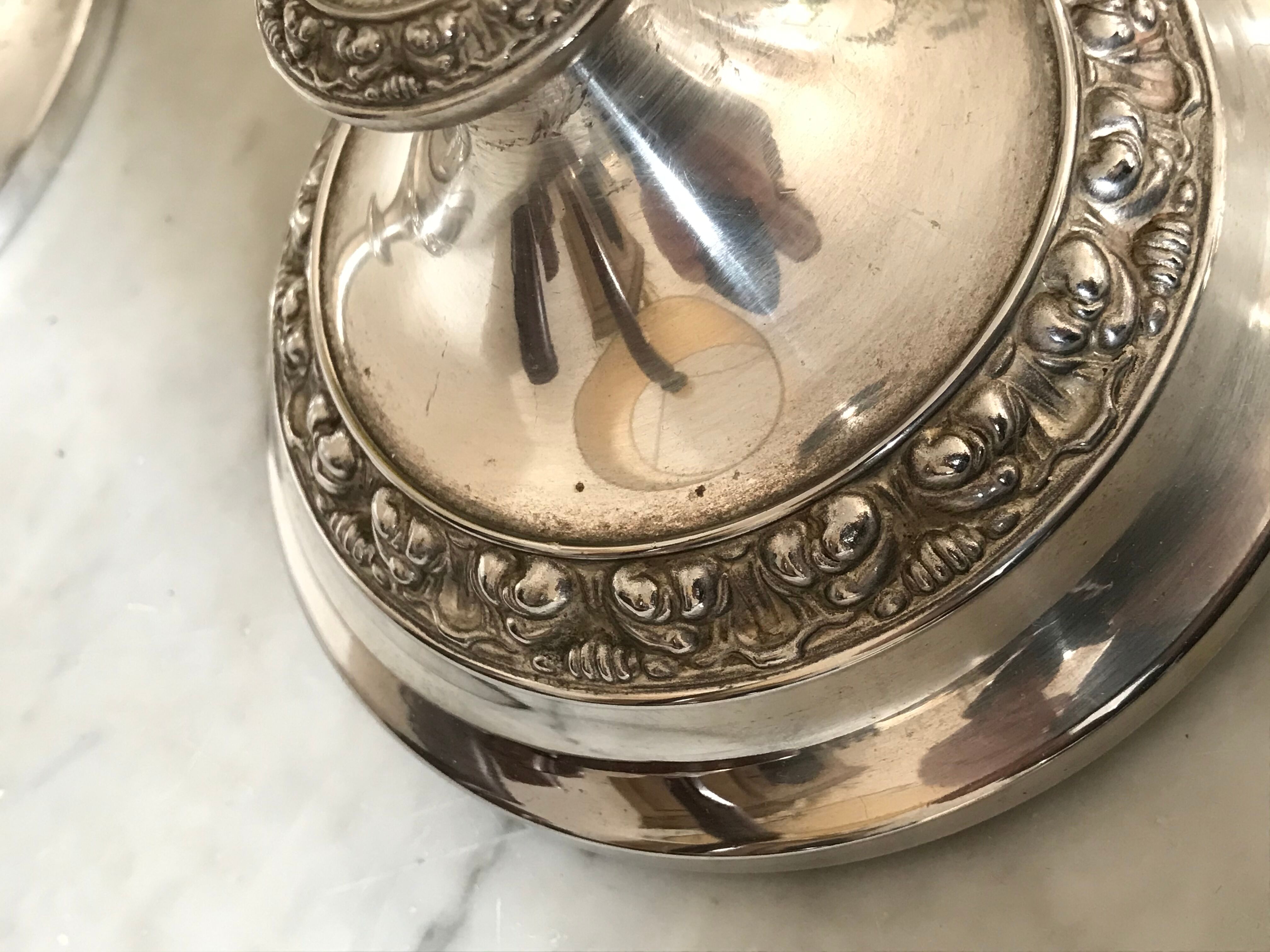Pair of silver metal candlesticks