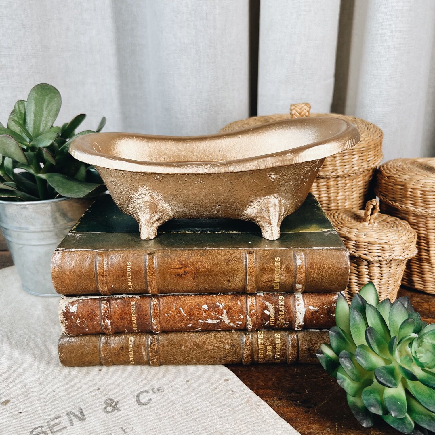 Cast iron soap dish in the shape of a bathtub
