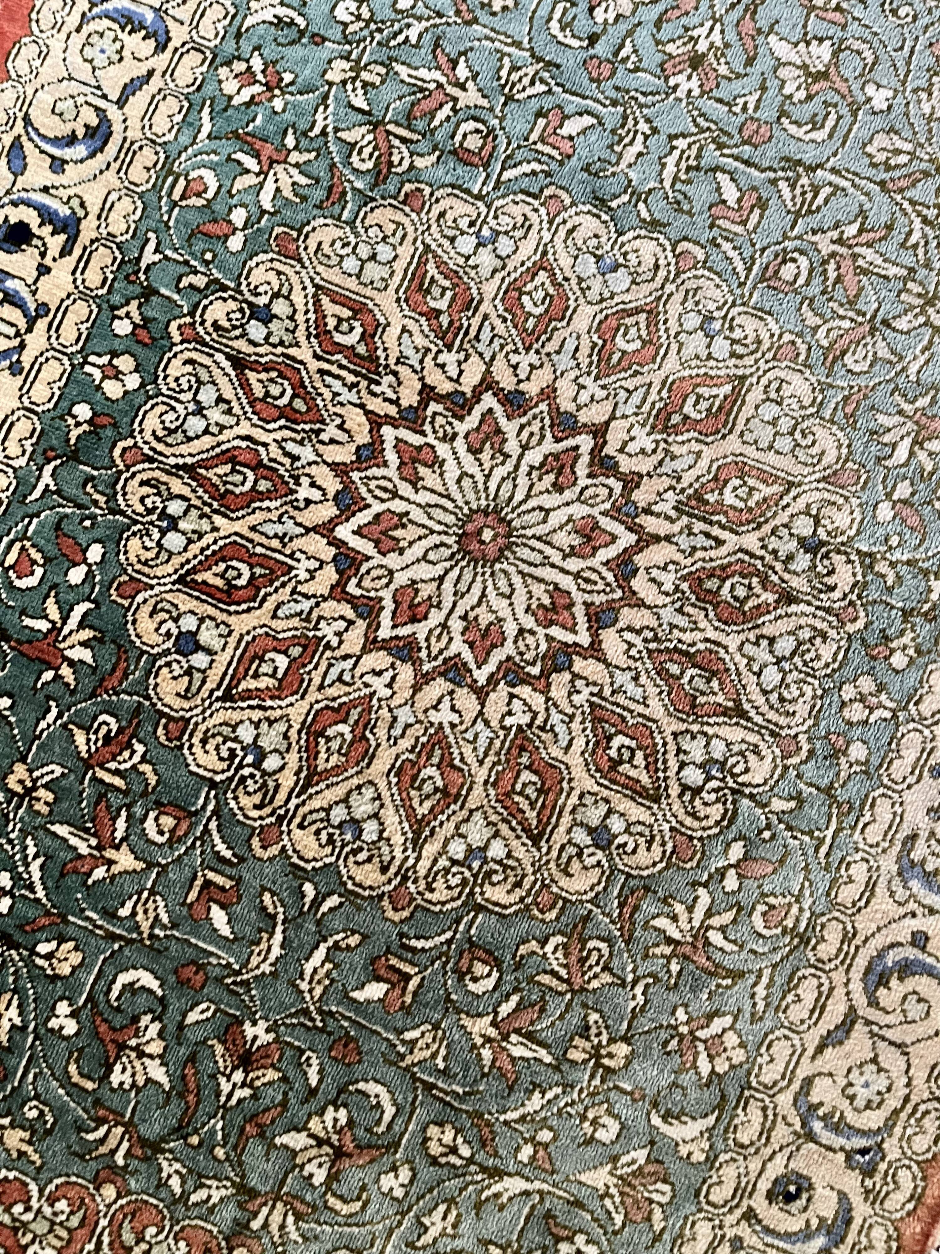 Sino Hereke oval silk rug