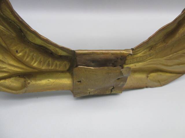 Old ornament in embossed brass - laurel wreath