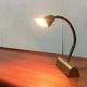 Mid-century brass swan neck table lamp in Hollywood Regency style from the 1960s.
