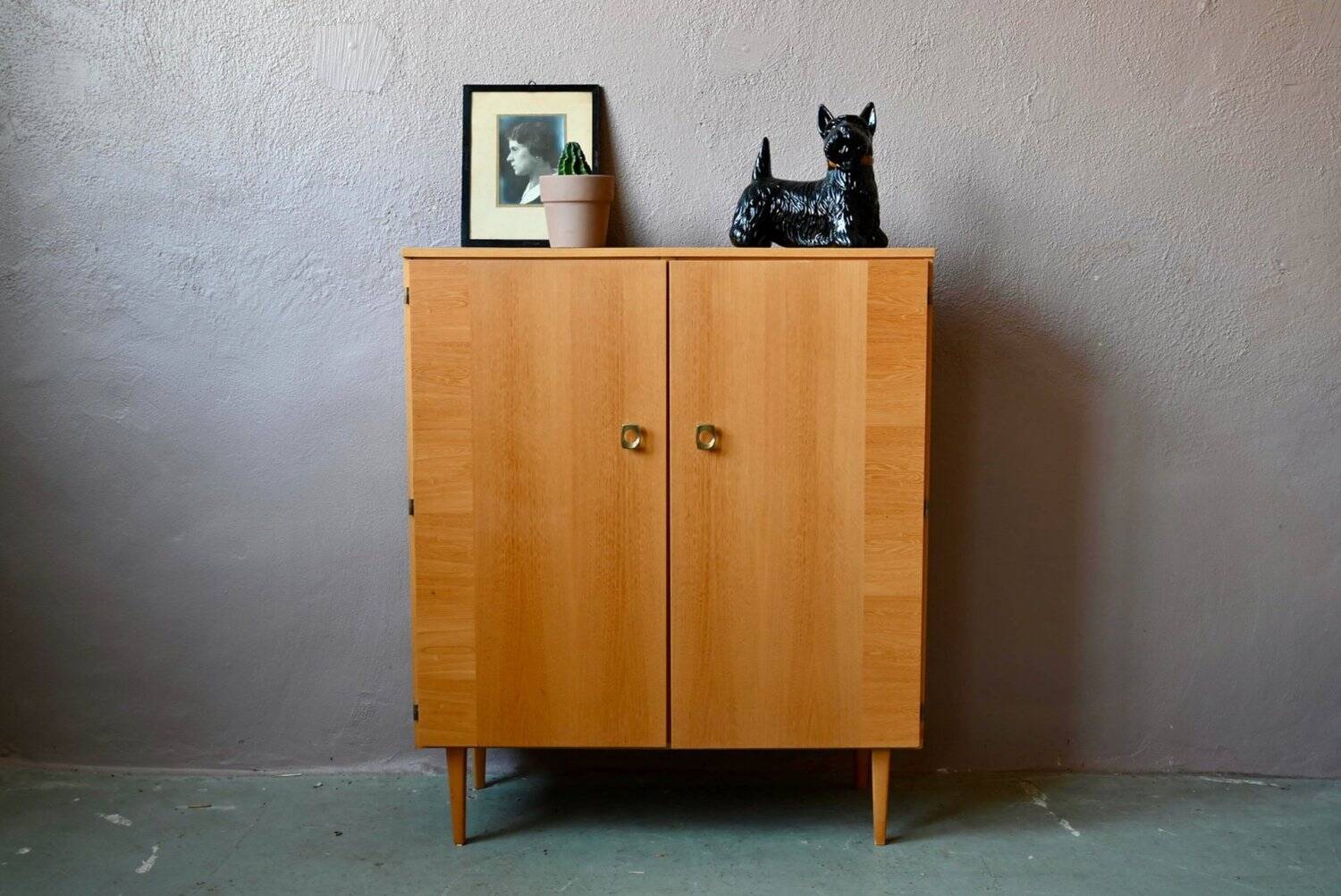 Vintage 1960s shoe cabinet in light wood and chrome metal.