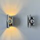 Pair of vintage wall lights, curved chrome metal, France, 1970.