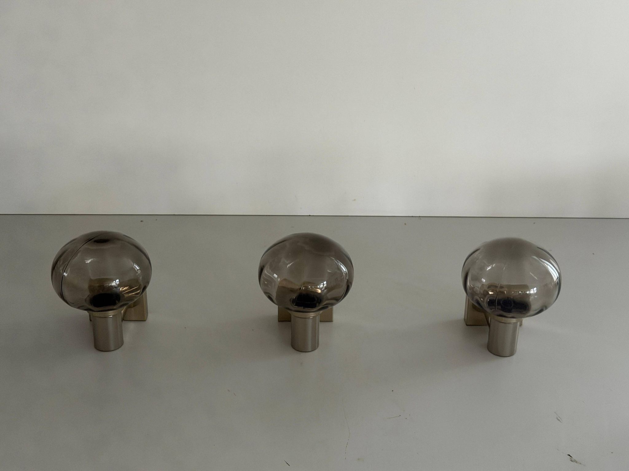 Set of 3 grey glass and chrome wall lights from the mid-century by N Leuchten, 1960s, Germany.