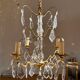 Chandelier set & 4 wall lights with pendants, Louis XV style, gilded metal