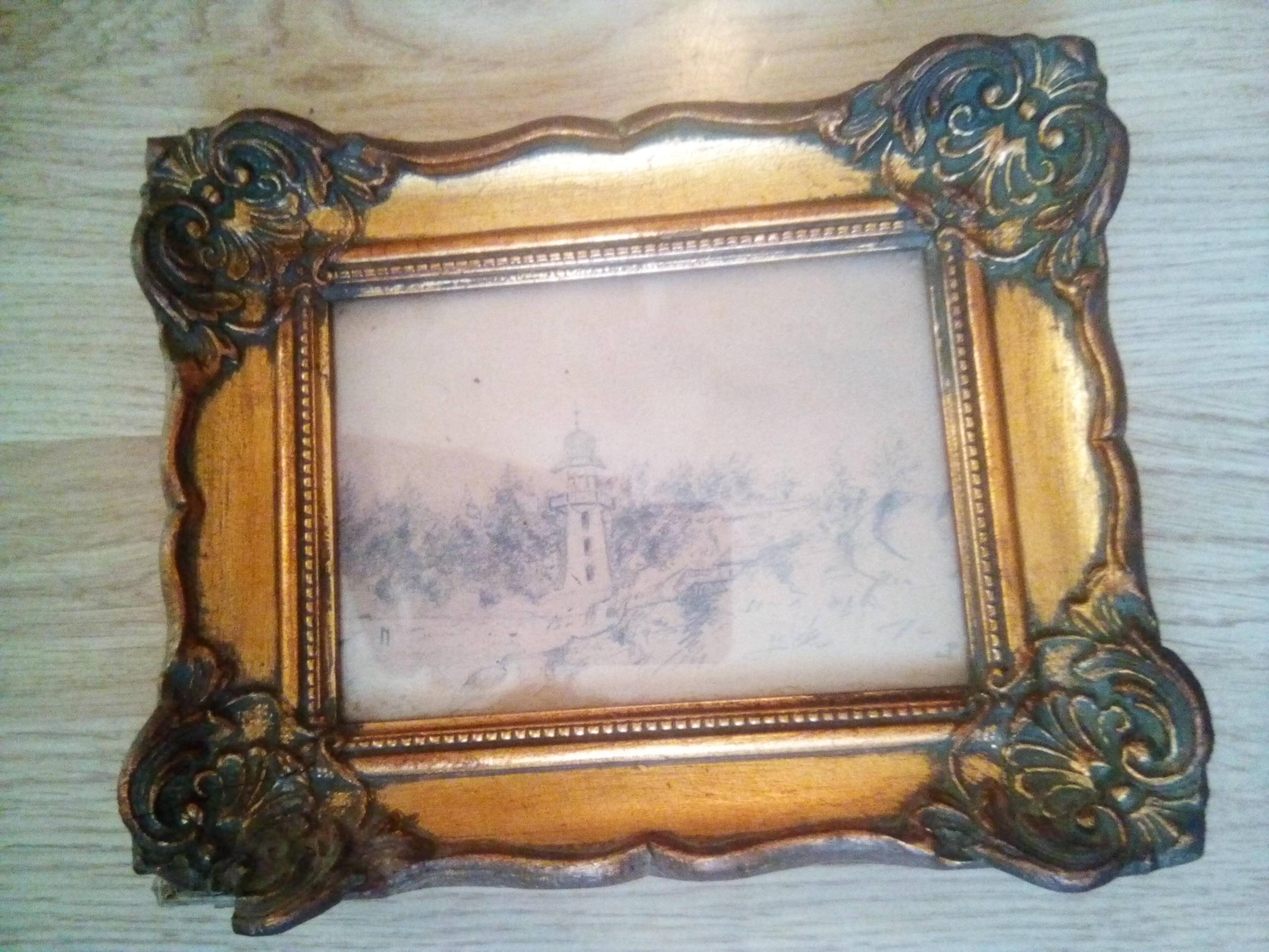 Vintage painting depicting a landscape with a lighthouse