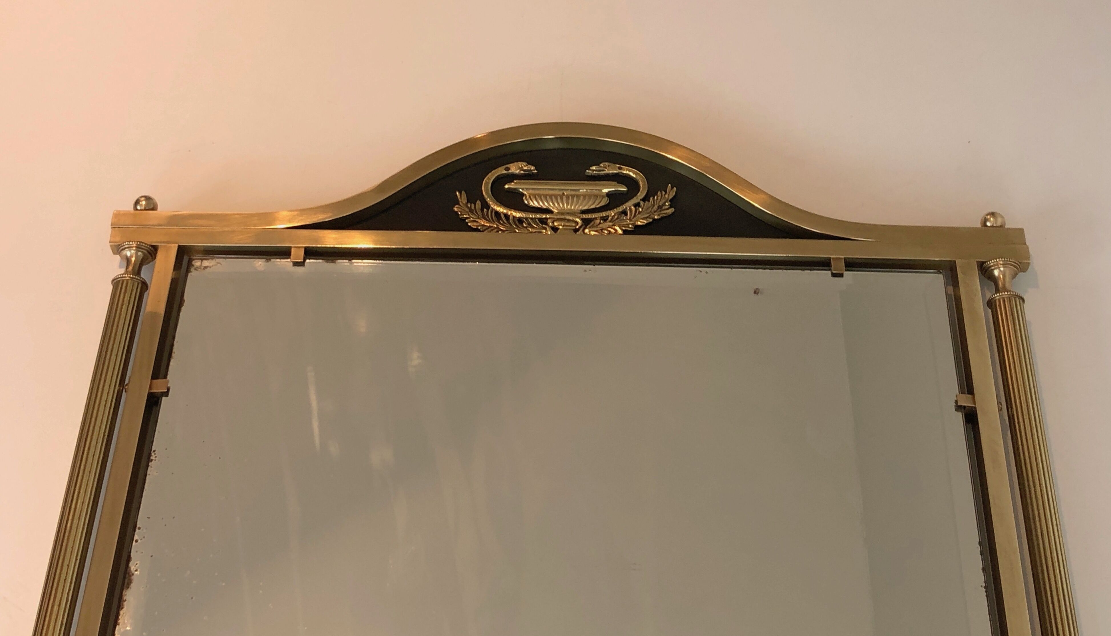 Neoclassical style mirror in brass and lacquered sheet metal