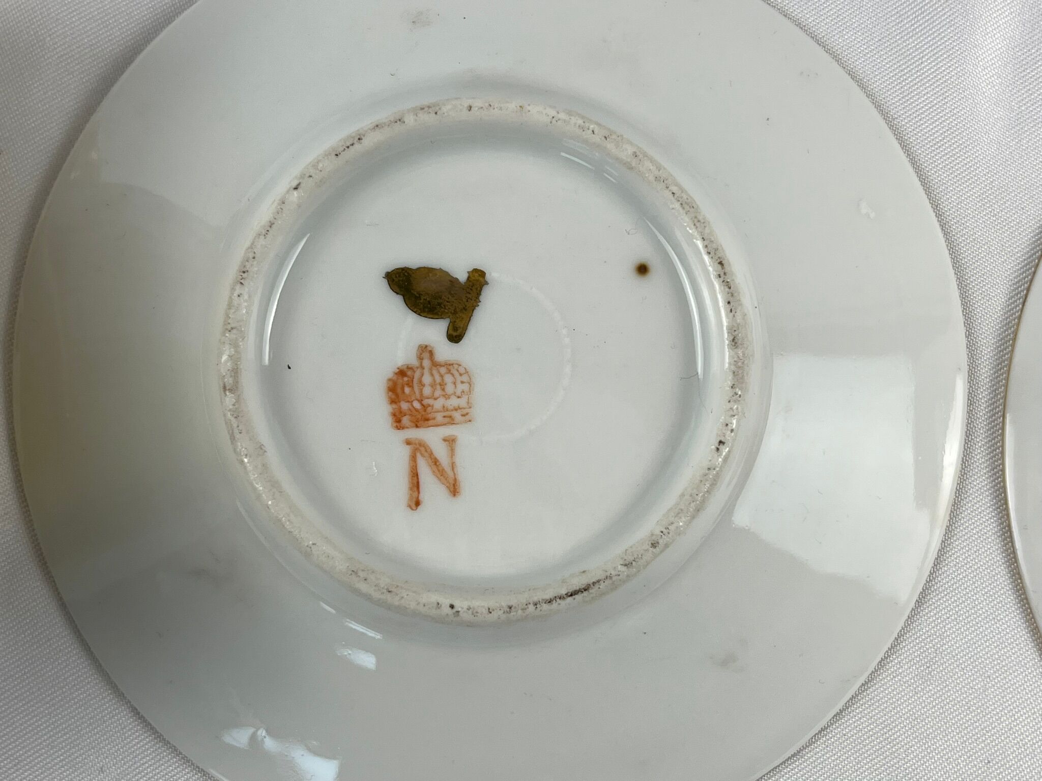 Tasses à café Napoléon en porcelaine début XXème