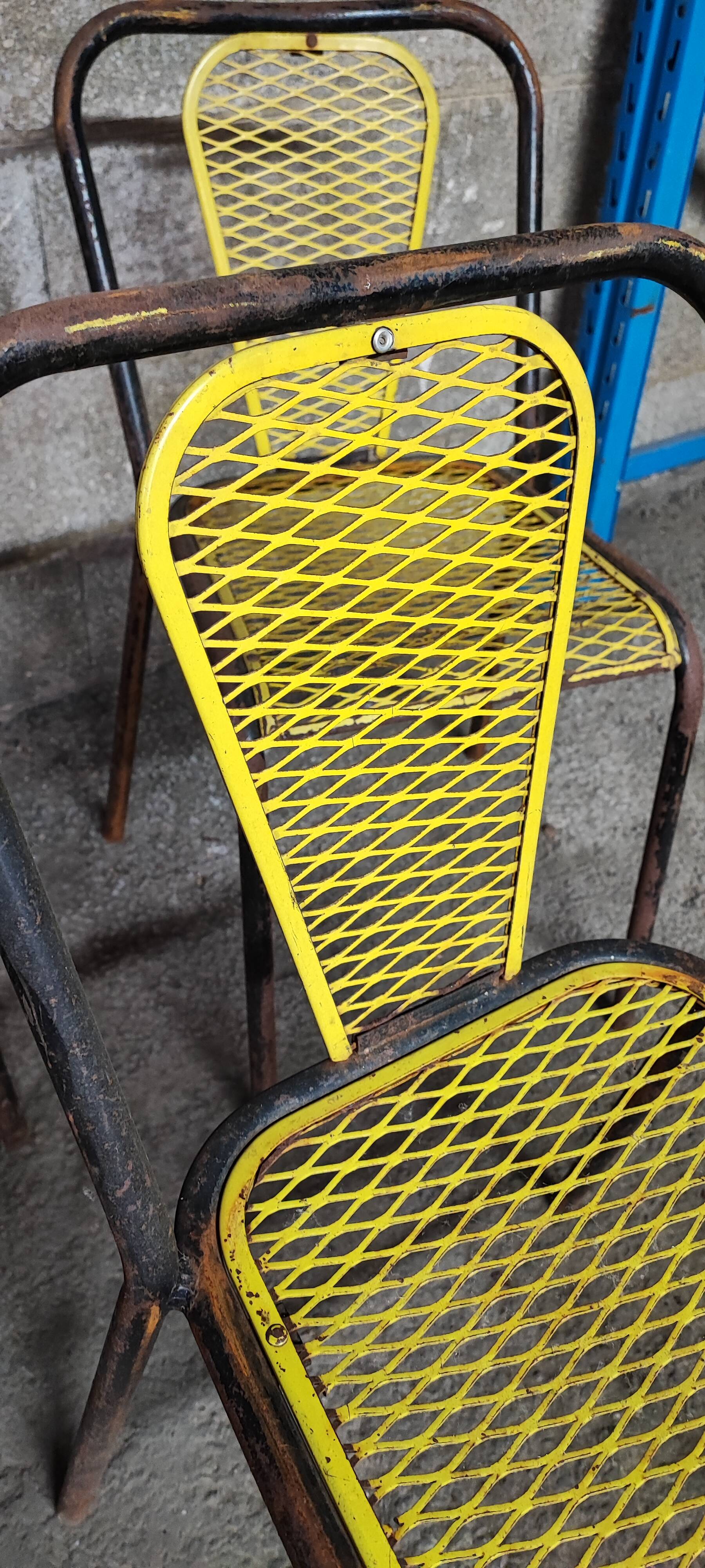 Six chaises en métal perforé seducta René Malaval
