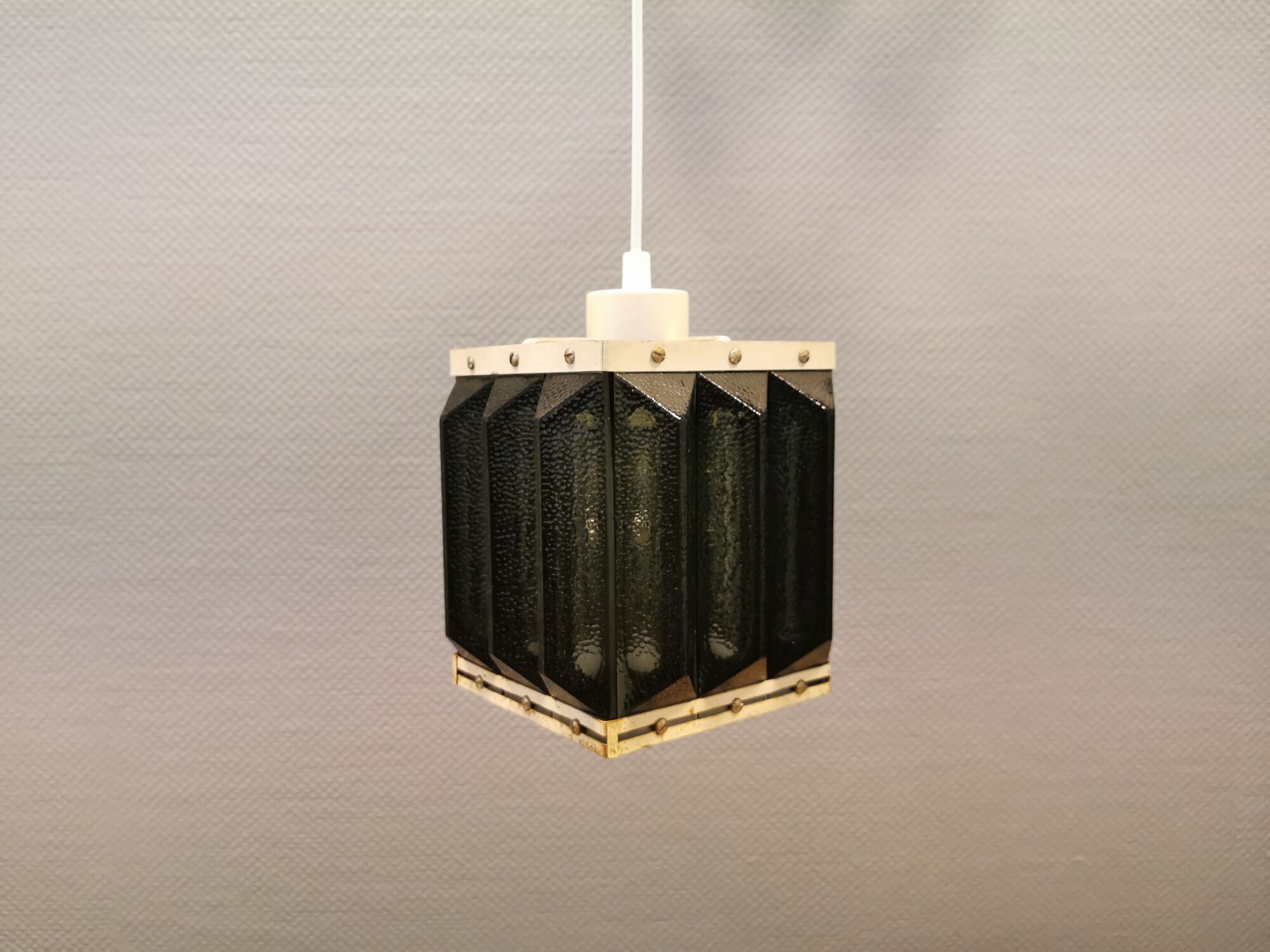 Old Swedish lamp made of metal and smoked solid glass pieces.