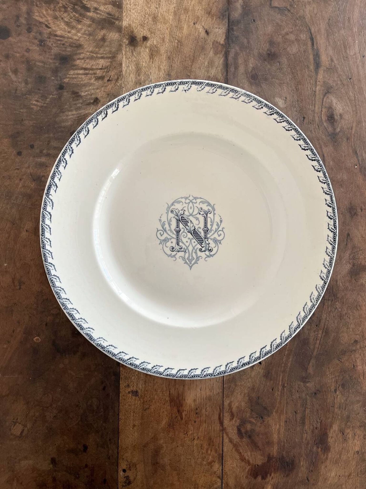 Round iron earth dish monogram “N” KG Lunéville