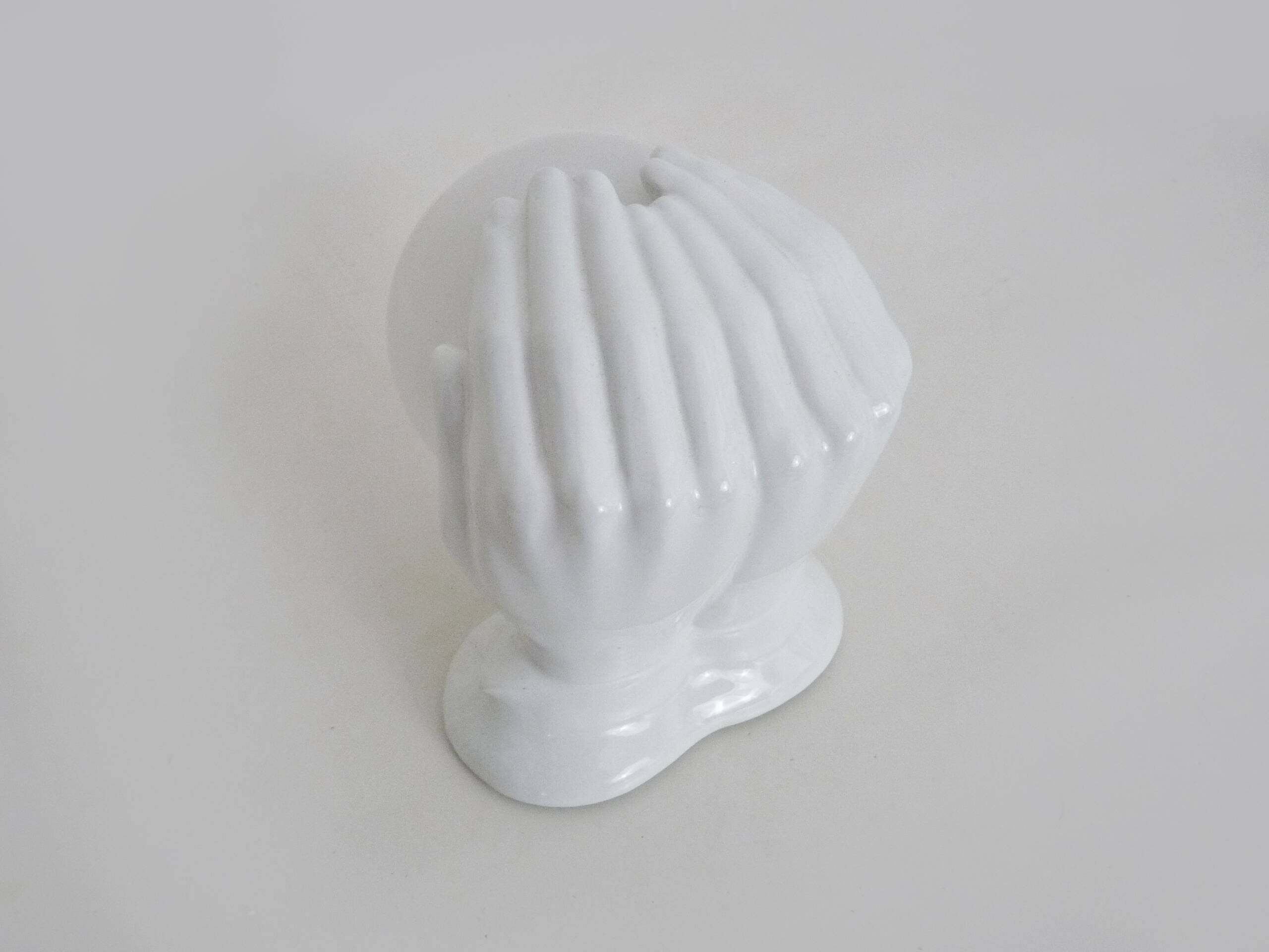 Ceramic pair of hands wall light from the 1970s.