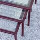 Nesting tables in burgundy lacquered metal and brass, France 1950s