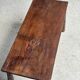 Table basse en teck brun de seconde main indonésienne pieds coniques H37 L8