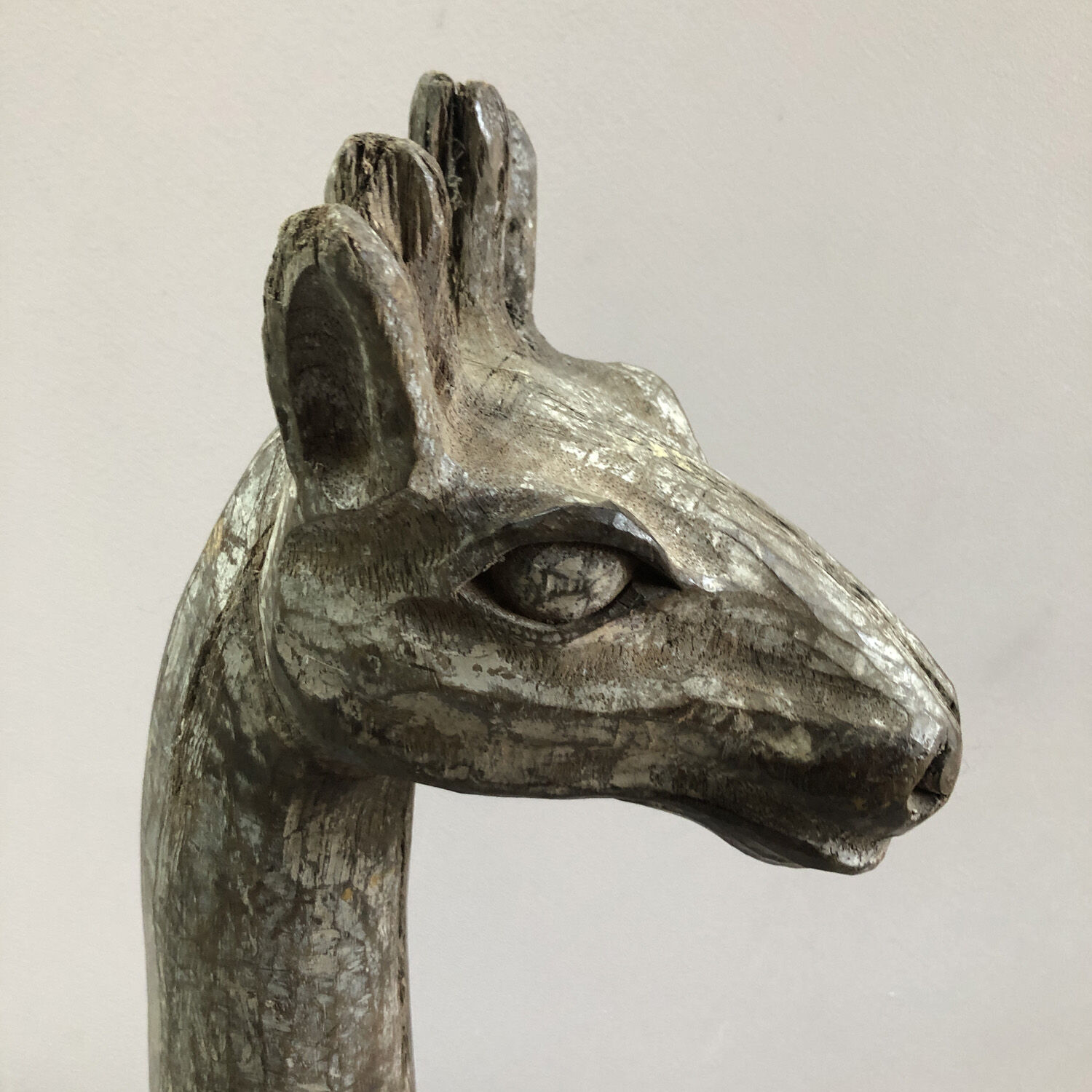 Wooden giraffe sculpture