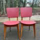 2 Scandinavian chairs in solid wood and burgundy leather from the 1970s.