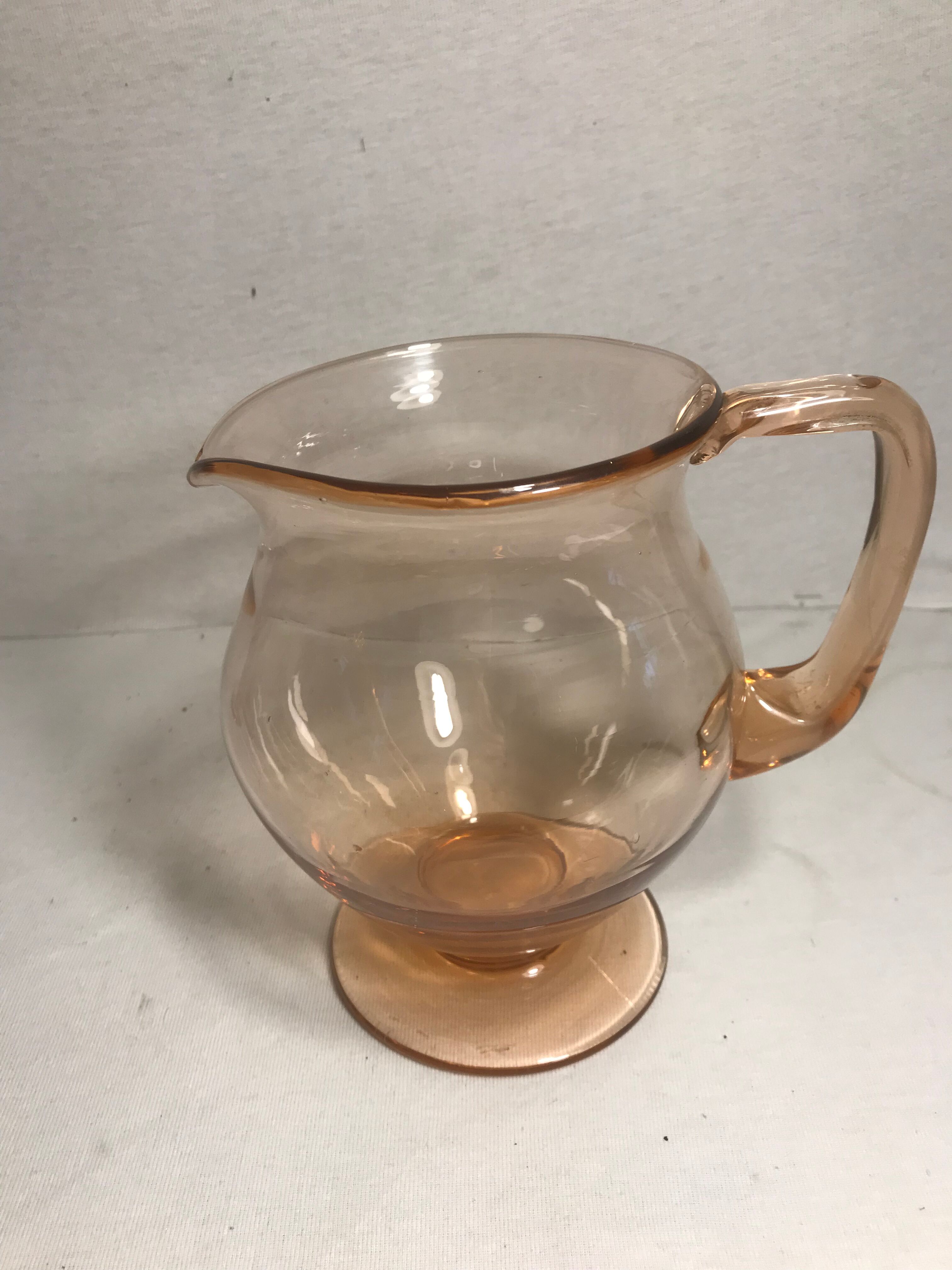 Pink pitcher in bubble glass