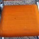 Pair of designer armchairs in orange fabrics and chrome tubes from the 70s