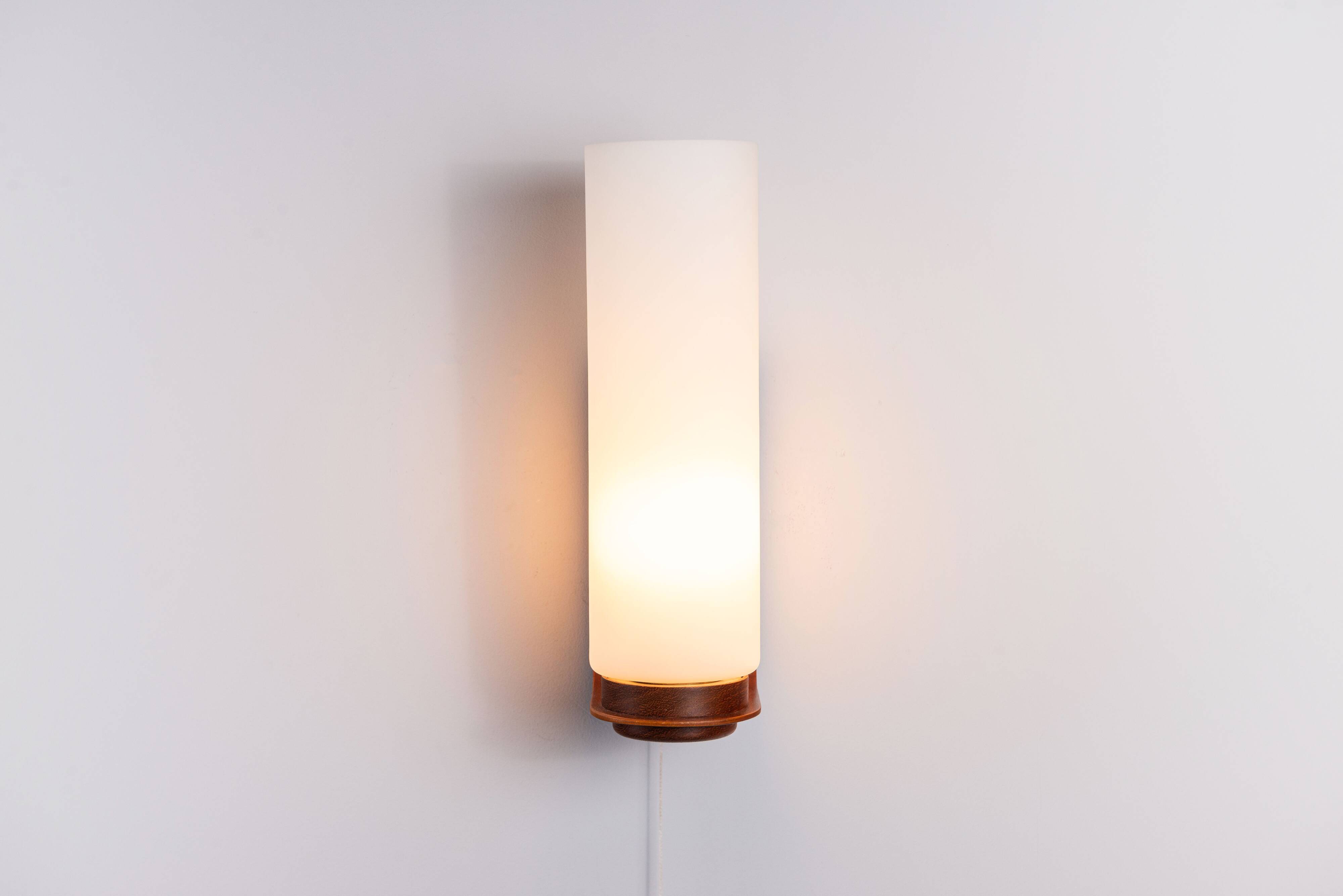 Cilindrical opal glass and bent wood wall lamp