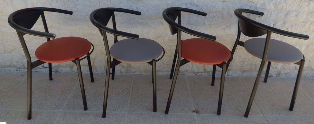 4 Gondola-style chairs with a sturdy metal frame and faux leather for