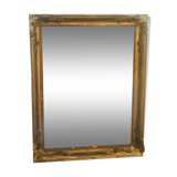 Old mirror with gilded leaves and flowers carved on top of it 1800s