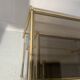 Suite de trois tables gigognes de style en laiton et verre fumé XX siècle