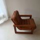 Vintage lounge chair in teak and leather from the 1960s.