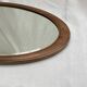 Oval beveled mirror surrounded by light wood dimension: height -74,5cm- width -38,5cm- prof-2cm-