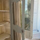 Antique French carved display cabinet with wire mesh doors