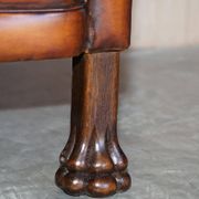 Victorian Chesterfield leather canapé with oak lion claw feet.
