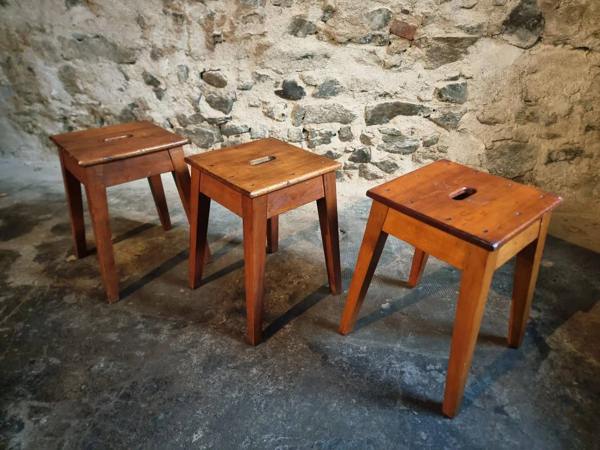 Set of 3 vintage French wooden stools from the 1950s.